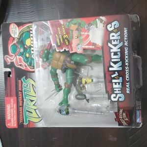 Teen age mutant ninja turtles Raphael she'll kickers figure.